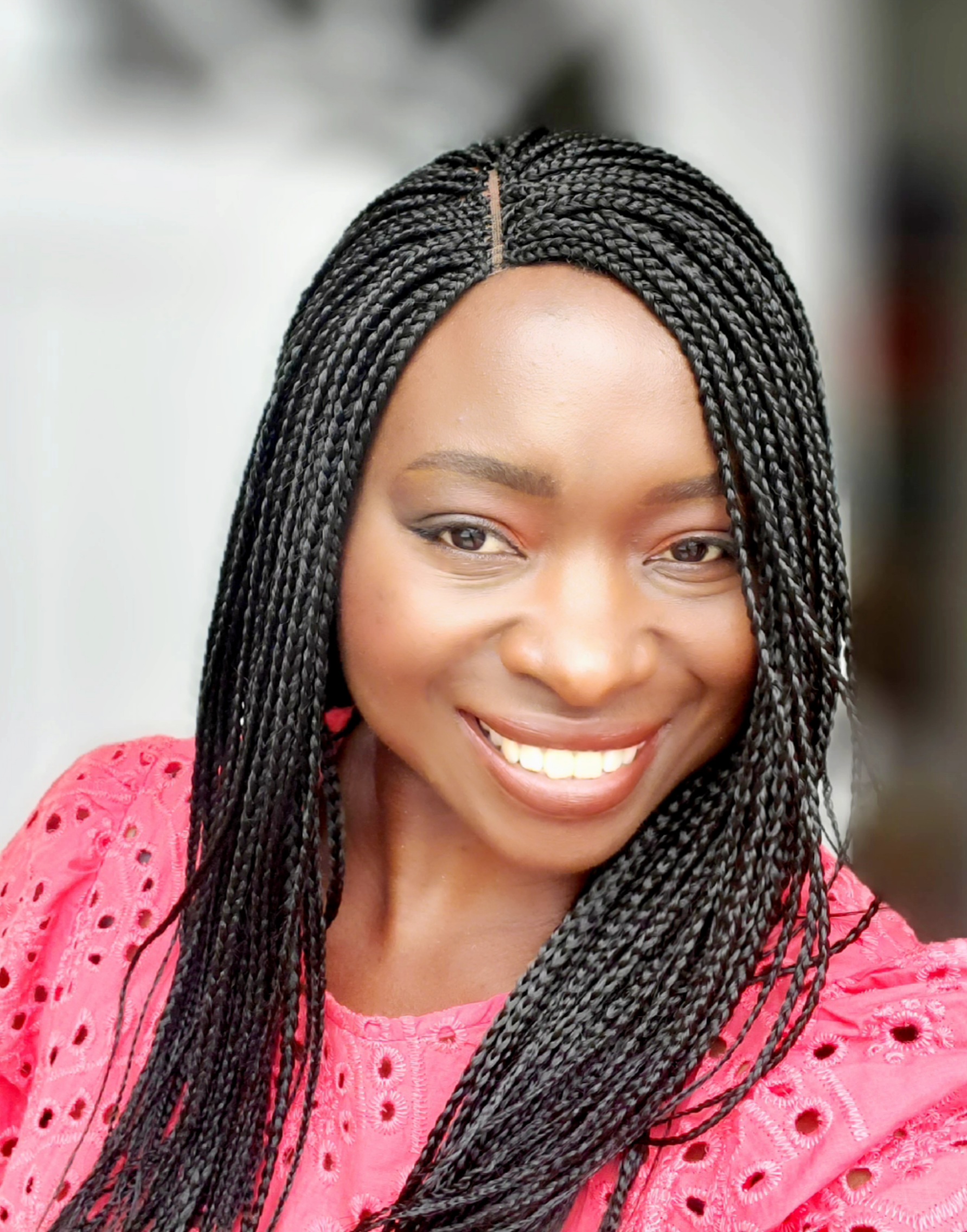 Beautiful woman with long black braids smiling