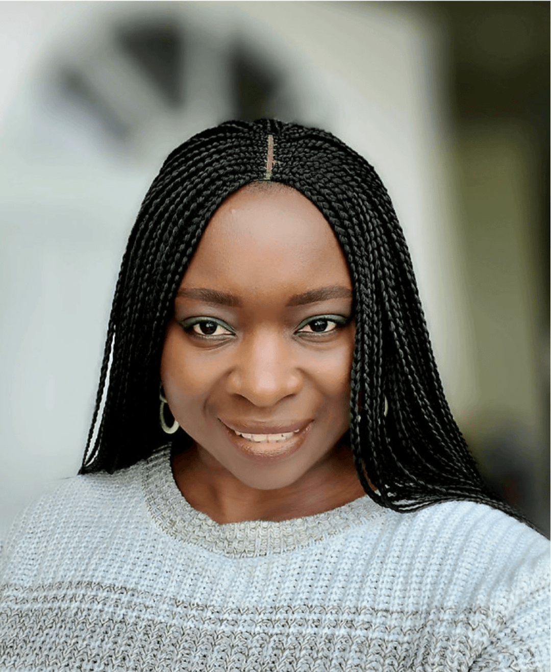 Founder of Buri's Hair Clues wearing beautiful knotless braids